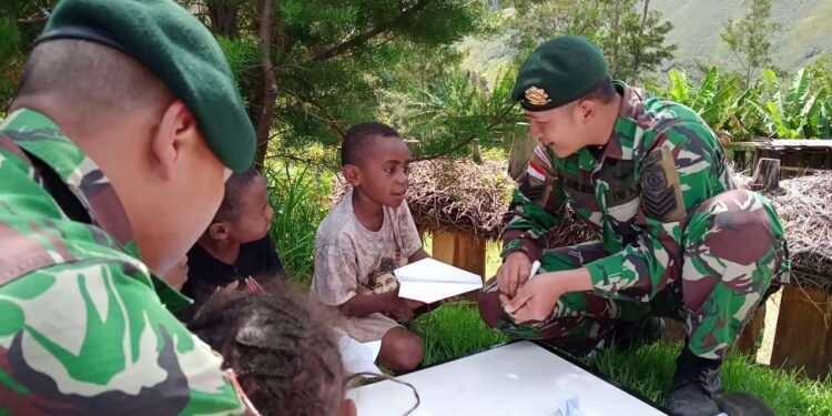 Satgas Yonif MR 412 Kostrad: Karena Kebahagiaanmu Adalah Kebahagiaan Indonesia.