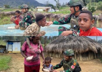 Buaya Putih Berbagi di Minggu Kasih, Pos Gome Satgas Yonif 323 Bagikan Makanan untuk Masyarakat