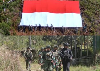 Satgas Yonif 323 Buaya Putih Kibarkan Bendera Raksasa di Atas Ketinggian Bukit Cakra Papua