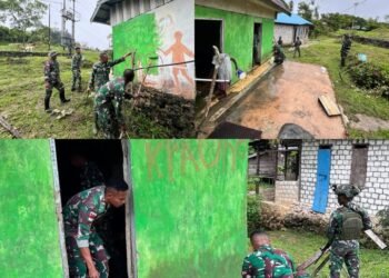Satgas Yonif 762/VYS Perbaiki dan Cat Ulang Toilet Umum Kampung