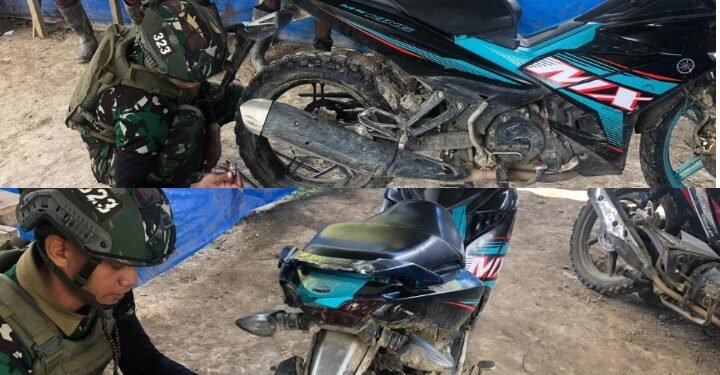 Prajurit Buaya Putih Perbaiki Kendaraan Warga